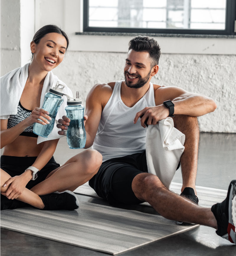Image of Woman and Man Recovering after a workout